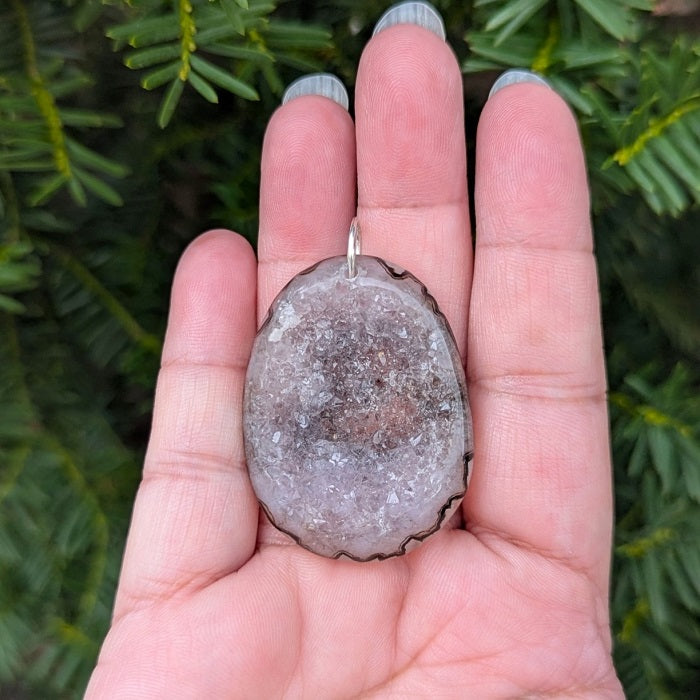 A beautiful natural druzy agate pendant with a sterling silver bail.