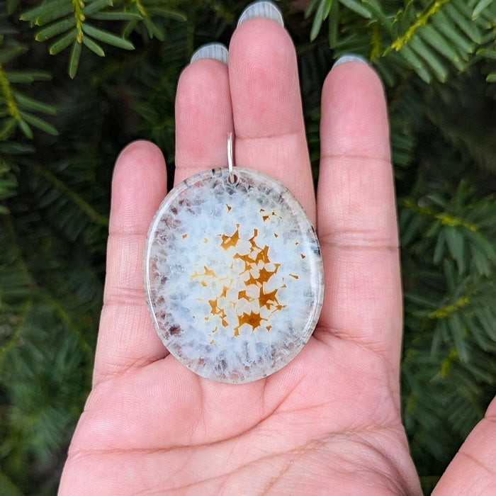 A beautiful natural druzy agate pendant with a sterling silver bail.