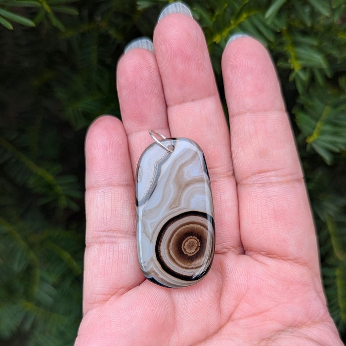A beautiful natural druzy agate pendant with a sterling silver bail.