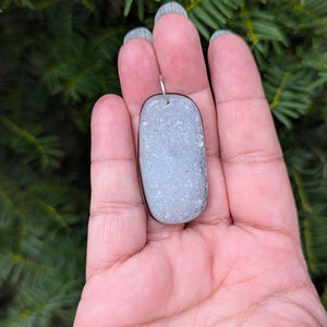 A beautiful natural druzy agate pendant with a sterling silver bail.