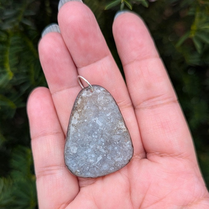 A beautiful natural druzy agate pendant with a sterling silver bail.