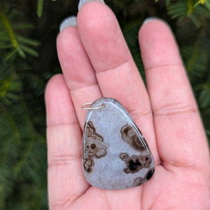 A beautiful natural druzy agate pendant with a sterling silver bail.