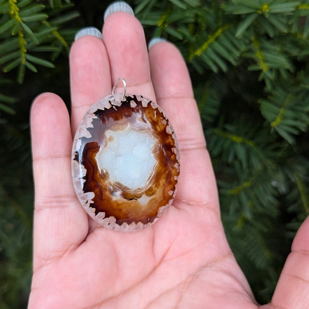 A beautiful natural druzy agate pendant with a sterling silver bail.