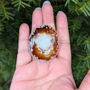 A beautiful natural druzy agate pendant with a sterling silver bail.