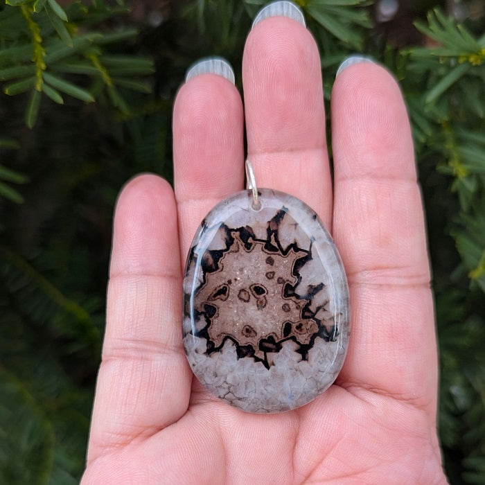 A beautiful natural druzy agate pendant with a sterling silver bail.
