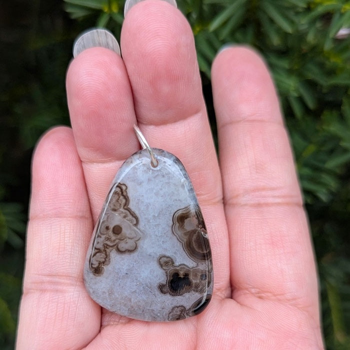 A beautiful natural druzy agate pendant with a sterling silver bail.