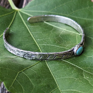 The Whitney Bracelet - Sterling silver and Turquoise bracelet with hand-crafted silver feathers.