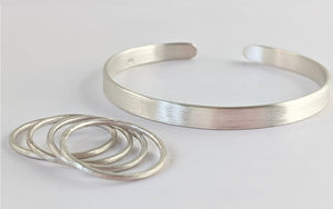 Silver Stacking Rings with a matching Brushed Sterling Cuff Bracelet